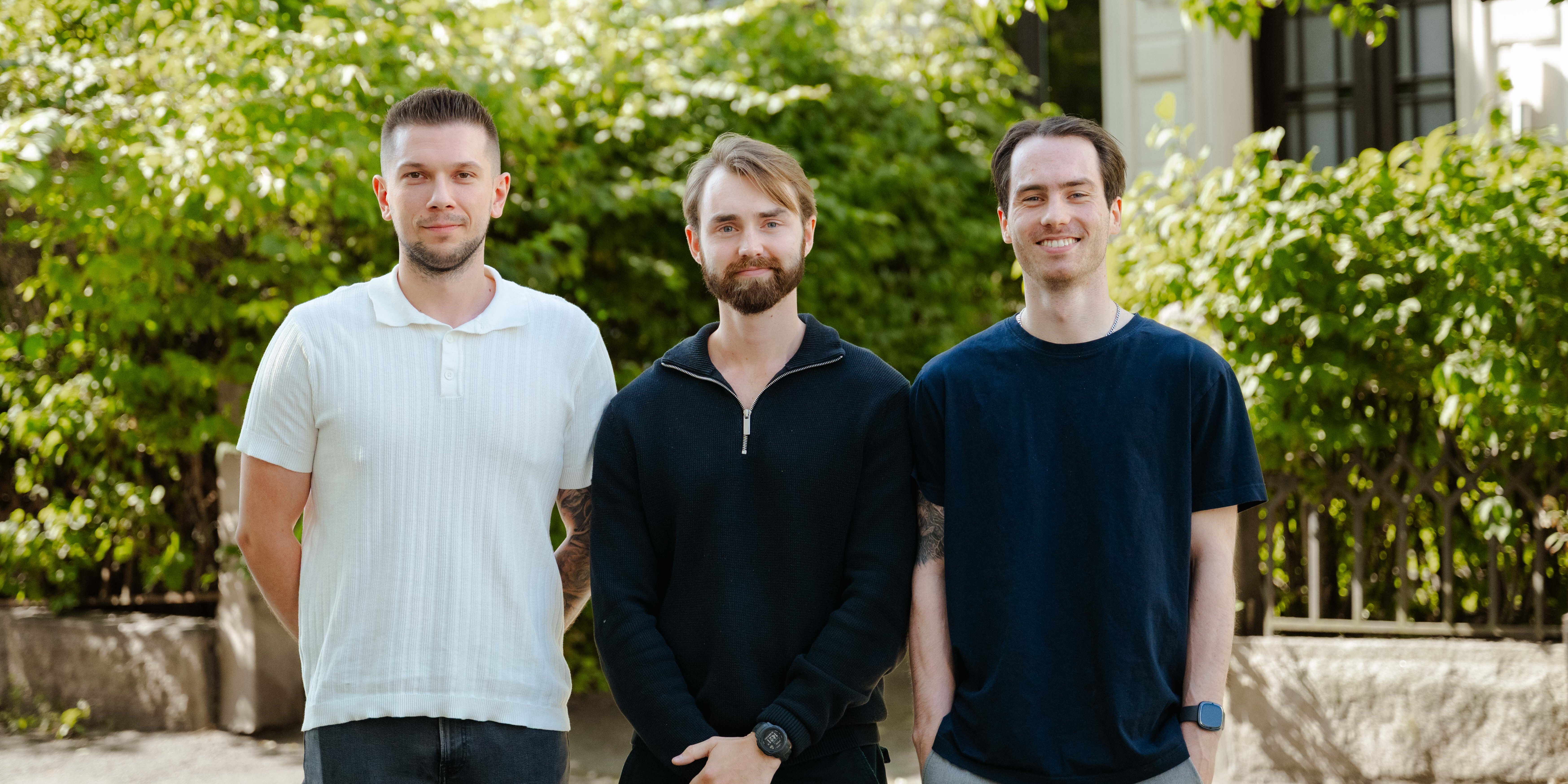 Photo of 3 Vince consultants in front of green trees